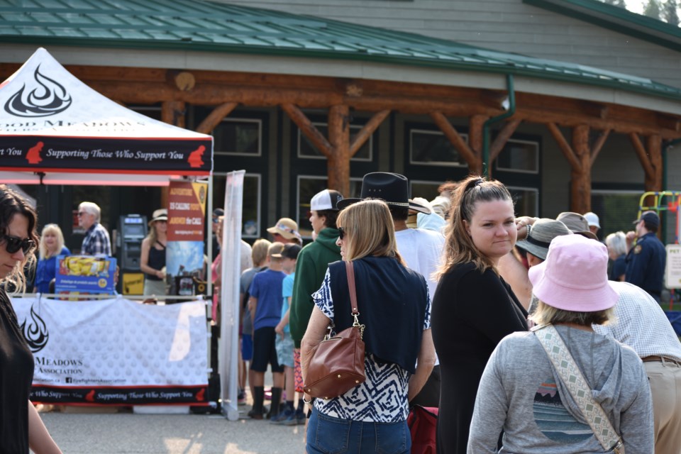 Visitors lined up to get their hot pancake breakfast at the Bragg Creek Days festival at the Bragg Creek Community Centre