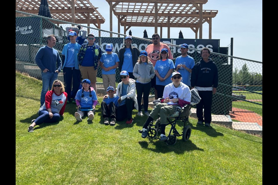 Image of the Cochrane Challengers in Okotoks, attending an Okotoks Dawgs baseball game