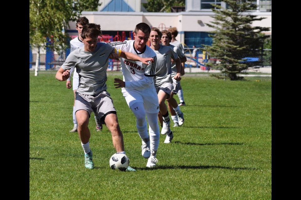 The Springbank Phoenix (in grey) defeated the Cochrane High Cobras 2-1 in the Rocky View Schools Soccer Finals on June 4 at Monklands Field in Airdrie.