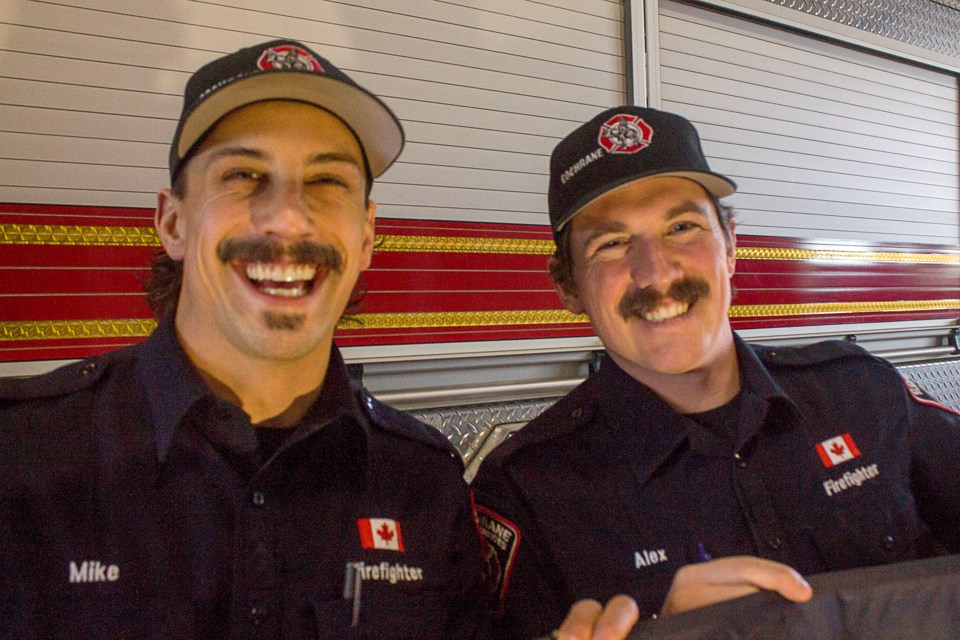 Mike Marianchuck (left) and Alex Vague sporting Cochrane Fire Services' finest moustaches for their Movember fundraising campaign.