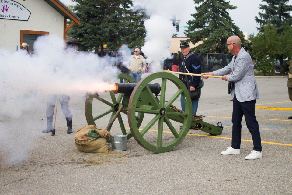 Mayor Jeff Genung firing off a cannon at the Cochrane Legion during the Cochrane Legion Show on Sept. 14.