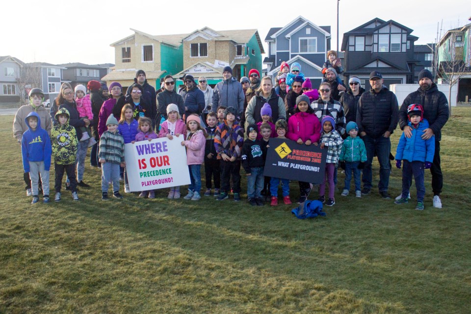 Families in the community of Precedence took to an open green space to protest the need of a playground in the community on Nov. 17.