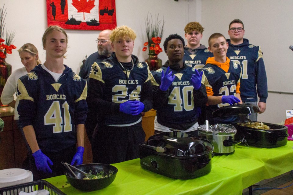 Members of the Bow Valley High School boys football team serving dinner at the Cochrane Legion on Oct. 11.