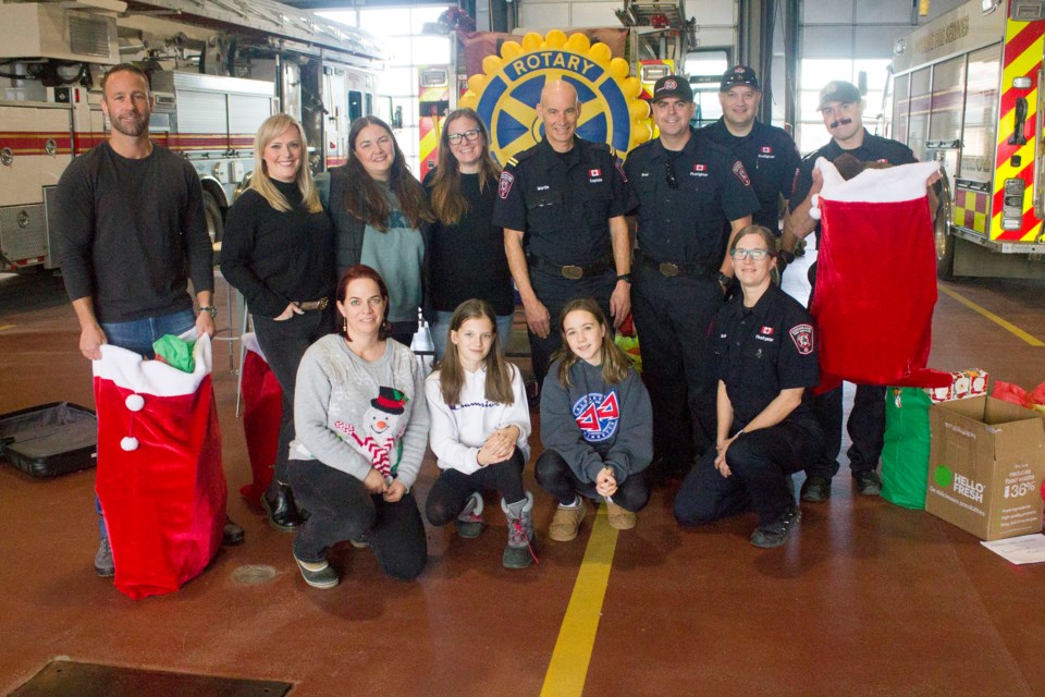 Members of Snap Dance, Rocky Mountain Rotary, and Cochrane Fire Services at the Cochrane Fire Station for the Toys 4 Kids Toy Drive on Dec. 21.