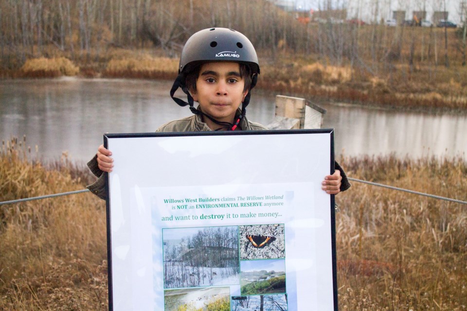 Residents of the Willows gathered near Wetland 80 for a peaceful demonstration to preserve the protected wetland from future developments.