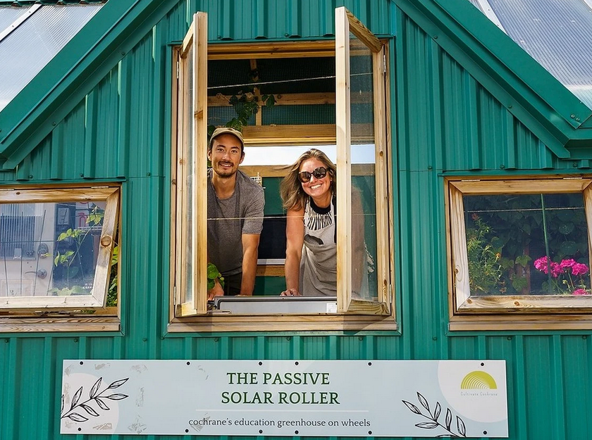 An image of Cultivate Cochrane team members inside of their 'solar roller' greenhouse on wheels. [credit: Steven Wilhelm]