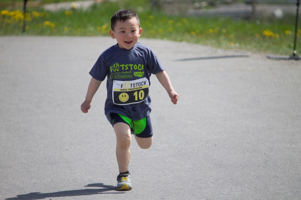 Young athletes participating in the 25th annual Footstock triathlon where they swam, pedaled, and ran through a special course at the SLS Centre on June 2. 