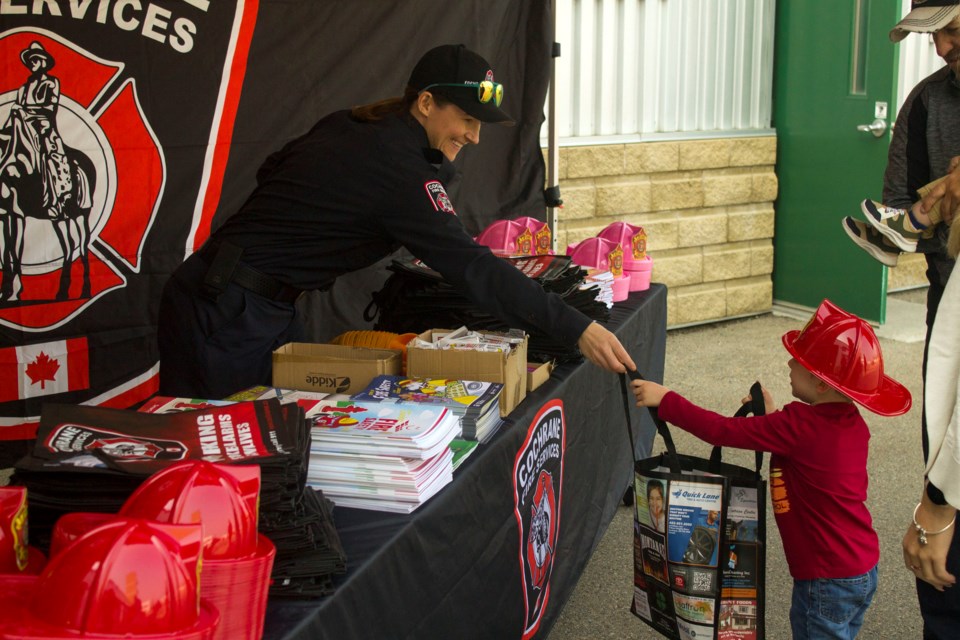 Cochrane Fire Services provided goodies for kids Kids had the chance to practice how to use a fire extinguisher at the Cochrane Station 151 tour held on Sept. 10.