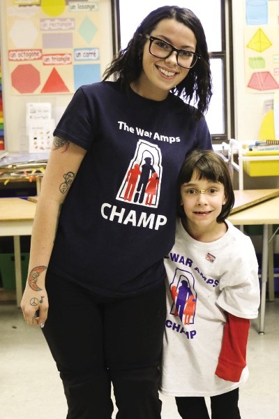 Jerlena Rittwage, left, and Nadine Richards speak to Elizabeth Barrett Elementary School students March 20 about living as an amputee and overcoming the challenges they face.