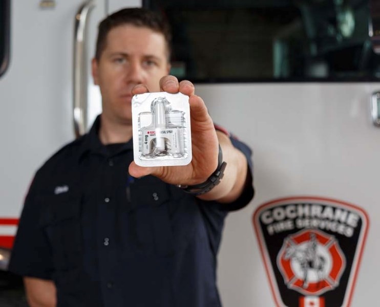 Chris Chyka, a firefighter for Cochrane Fire Services, holds up the intranasal spray at Cochrane Fire Hall on April 3. The firefighters will use it on people who are