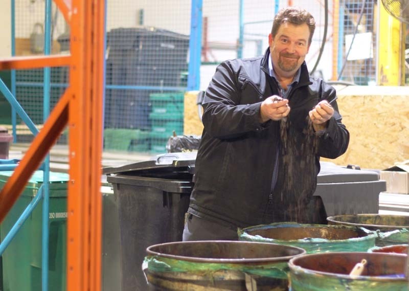 Glen Smith, a sales representative at Eco-Growth Environmental Inc., demonstrates how the organic waste brought into the facility is converted into a biomass, which can then