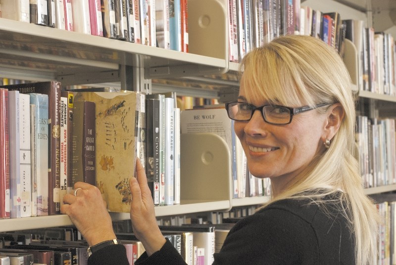 One of the goals of the Friends of the Nan Boothby Memorial Library is to raise funds to increase and improve the collection of books, CDs and films at the library. Here,