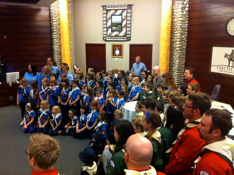 Approximately 70 Boy Scouts and Girl Guides showed up at the Feb. 11 council meeting to see Mayor Truper McBride sign the proclamation to make Feb. 17-24 Guide/Scout Week.