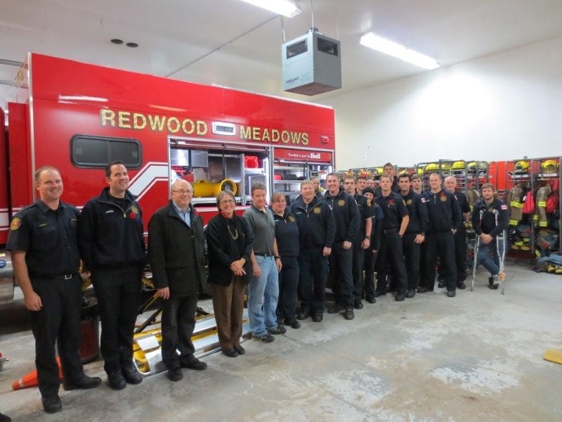 Members of Redwood Meadows Emergency Services, Redwood Meadows Firefighters&#8217; Association and the Shell Jumping Pound Complex pose with the new rescue truck.