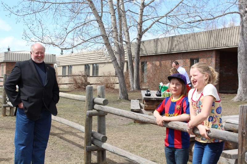 Nine-year-olds Finn Pitman and Sadie Kupery tell Banff-Cochrane MLA Ron Casey what they love about nature and what they as Grade 4 students at Glenbow Elementary School do to 