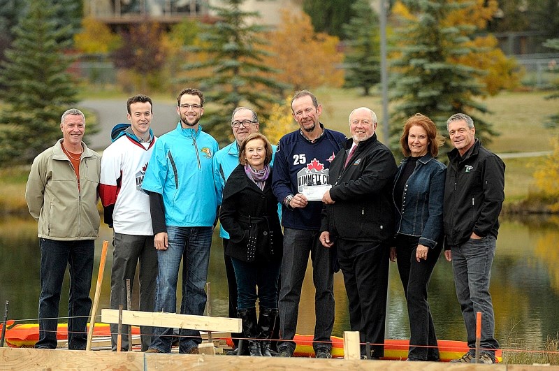 Ron Casey presented a $60,000 funding cheque to the Kimmett Foundation for the Mitford Pond project on Oct. 10. From left, town councillor Ivan Brooker, Reid Kimmett, Taylor