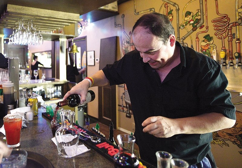 Ian Burns serves up drinks at Killarney&#8217;s Cochrane on Dec. 20.