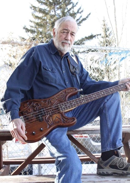 John White, bassist and frontman for the Smoking Aces, sports his custom, hand-carved bass, a Fender Precision Bass guitar, from G&#038;B ART Instruments in Poland. The