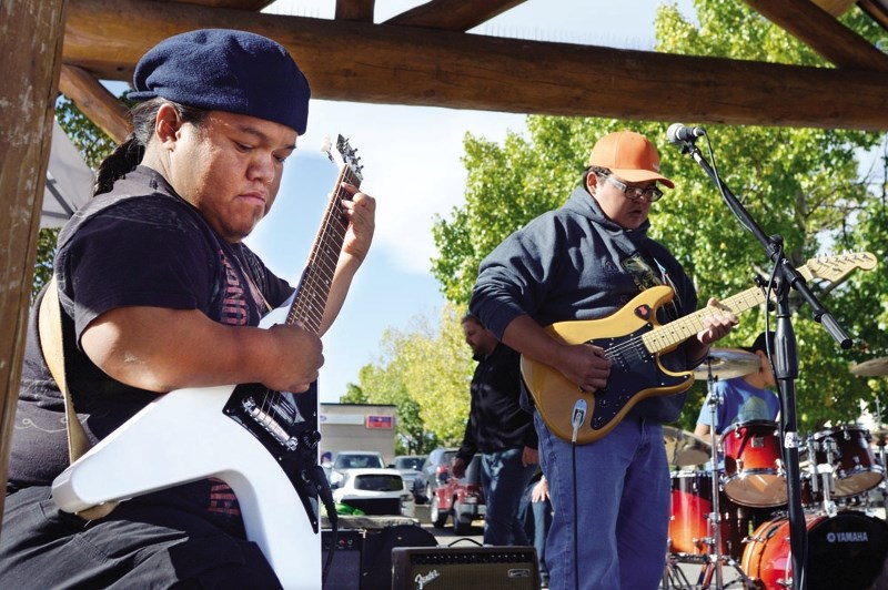 Eric Bearspaw, left, and Johnny Powerface of the Stoney River Band performed for the crowd of visitors at the Pickin&#8217; Party.