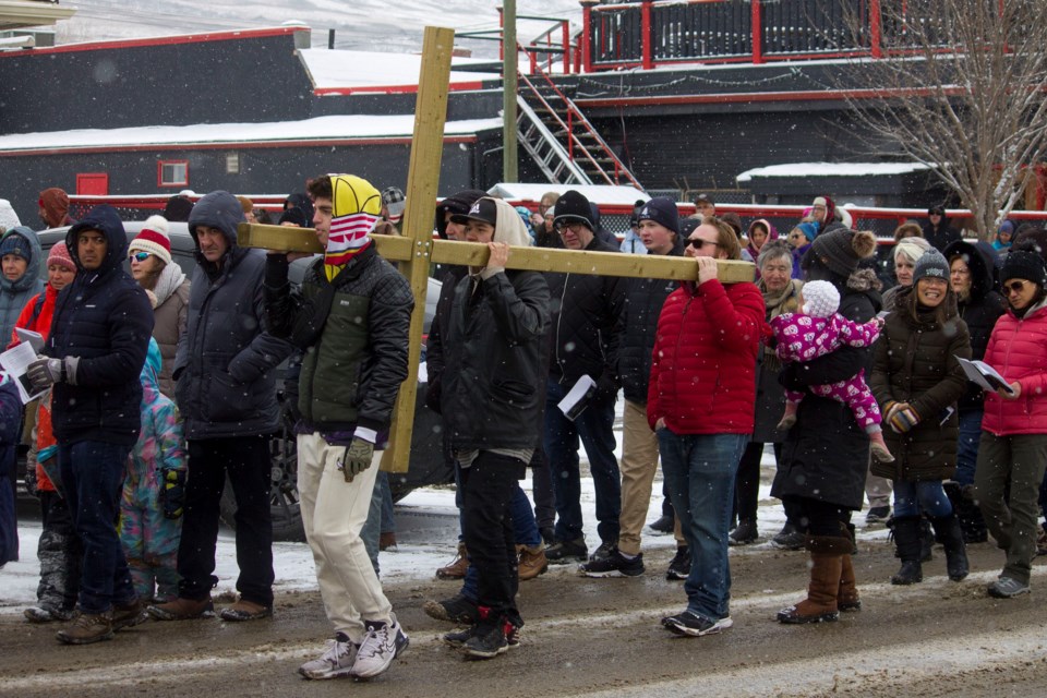 Believers in the community gathered along First St. for Cochrane's annual Walking of the Cross, that took place on on Good Friday.