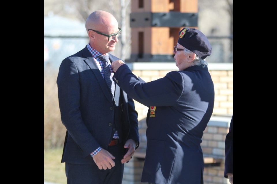 Mayor Jeff Genung receives first ceremonial poppy as the Cochrane Legion Branch 15 kicks off its 2024 Poppy Campaign at The Station on Friday, Oct. 25.