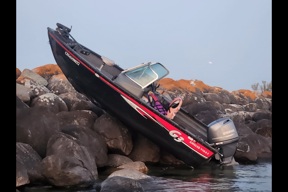 A boat ran ashore on some rocks by Hen and Chickens Island on the west side of Collingwood harbour on Aug. 25. 