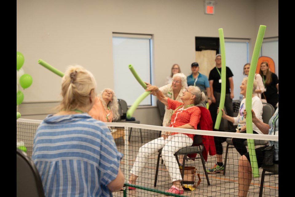 Older adults are seen playing pool noodle volleyball at a recent Techie Nesters event at the Collingwood Leisure Time Club. 