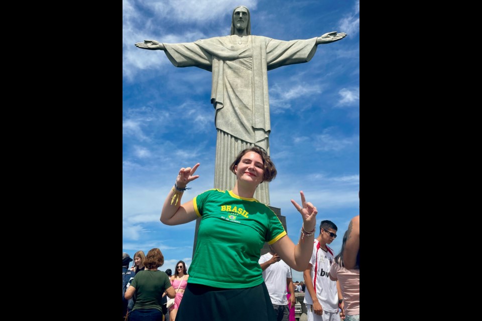 Rotary Youth Exchange student Olivia Walmsley, 17, has returned from a year in Brazil. She's seen at the foot of the Christ the Redeemer statue in Rio de Janeiro.