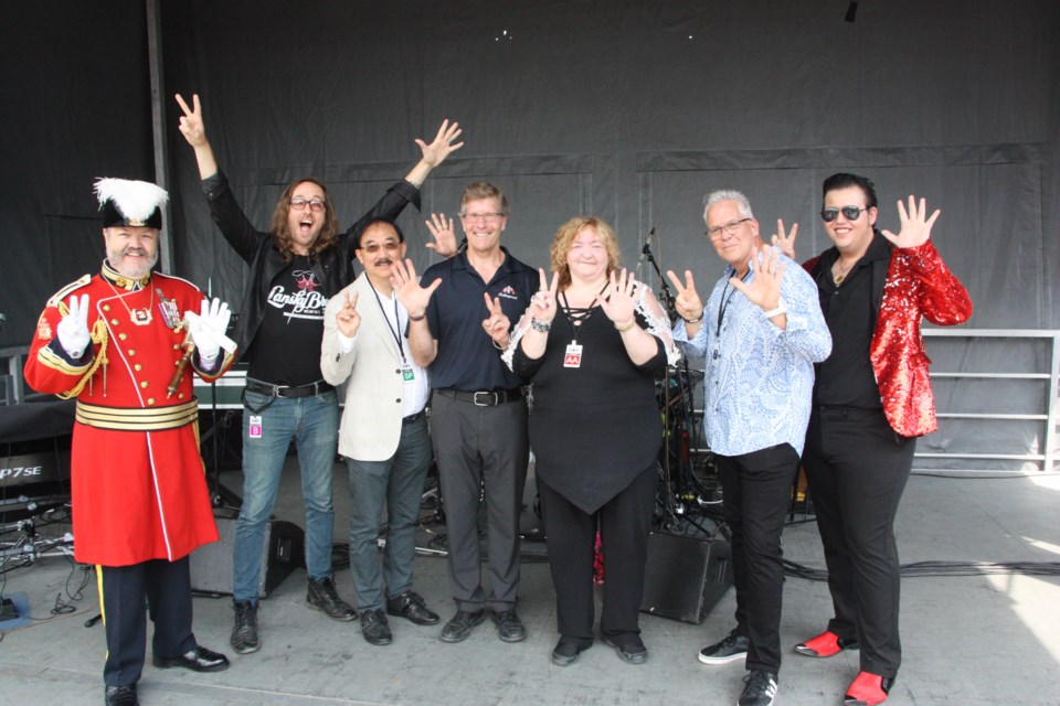 Celebrating 25 years of the Collingwood Elvis Festival. From left: Town Crier Ken Templeman, Memphis Jones, Larry Law, Mayor Brian Saunderson, Rosemarie O'Brien, Dan Barrella, and Dustin Bricker. Erika Engel/CollingwoodToday