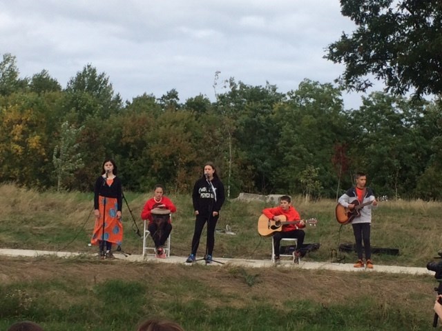 Students perform Stranger by Gord Downie during Orange Shirt Day at the Awen Gathering Circle. Contributed photo