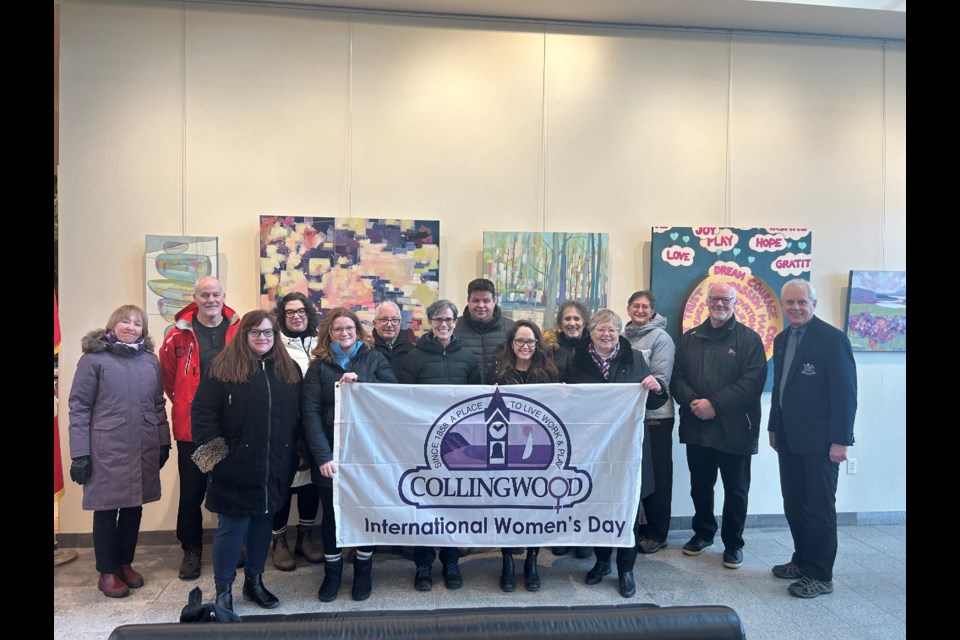 A group of Collingwood council members, staff and residents raised the International Women's Day flag at the Collingwood Public Library town flag pole on March 6 ahead of Women's Day on March 8. 