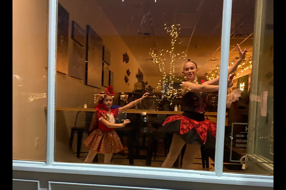 Fleet-Wood dancers perform in downtown store windows during the 2023 Christmas market. 