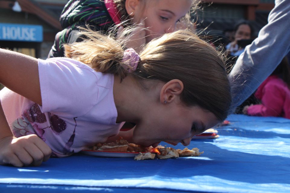 This young lady couldn't resist an apple pie eating contest at the Apple Harvest Festival. Maddie Johnson for CollingwoodToday