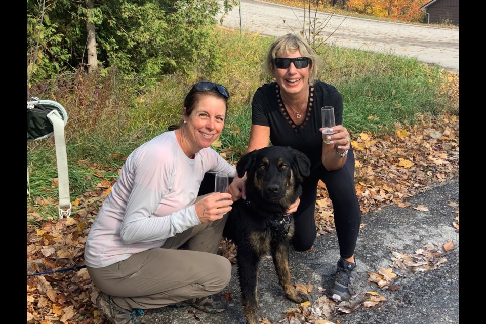 Jennifer Hurst from Collingwood and Andrée and Ikon Lovelle from Ravenna have been hiking the local sections of the Bruce Trail this spring and summer with a new puppy. Contirbuted photo