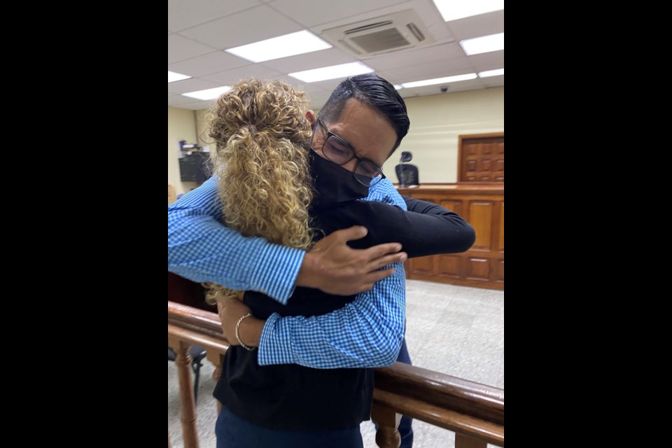 Karen Spring embraces her friend Raul Alvares after a Honduran court declared he was innocent of the charges laid against him that kept him in an inhumane prison for 19 months. Karen's husband was also cleared of charges after the same imprisonment. 