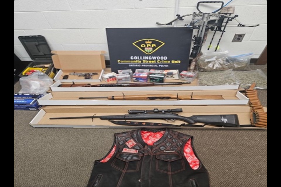 Police seized guns and other items from two residences in Innisfil on Thursday.