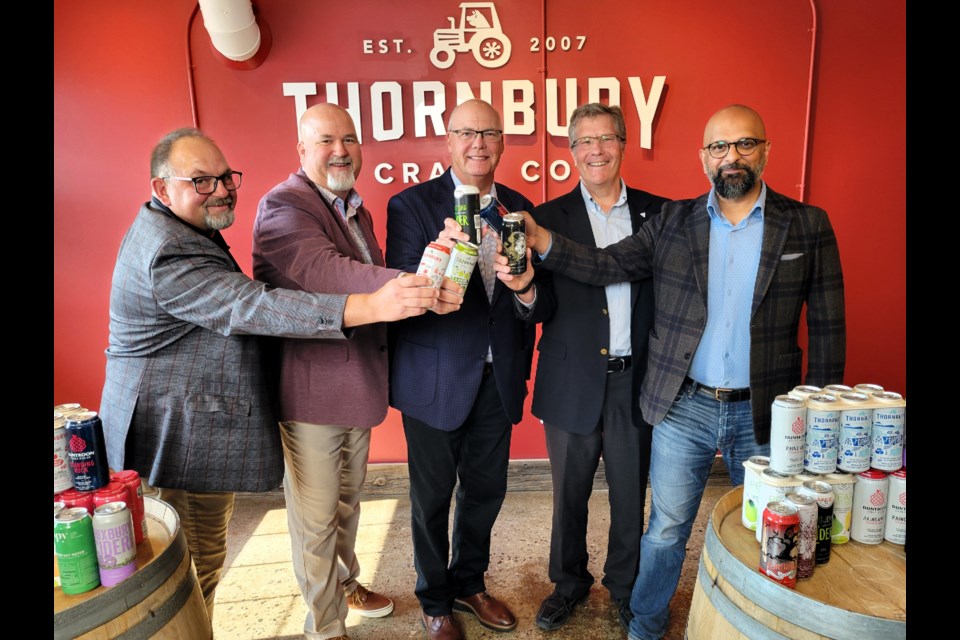 Brian Rideout, chair of the Ontario Apple Growers Association (from left), Derek Cartlidge, president of Thornbury Craft Co.,  Rob Flack, provincial minister of agriculture, food and agribusiness, Simcoe-Grey MPP Brian Saunderson and Zee Hamid, parliamentary assistant to the provincial minister of finance, were in attendance for an announcement of the province’s $6-million Ontario Craft Cider Marketing Fund at Thornbury Craft Co. on Wednesday.