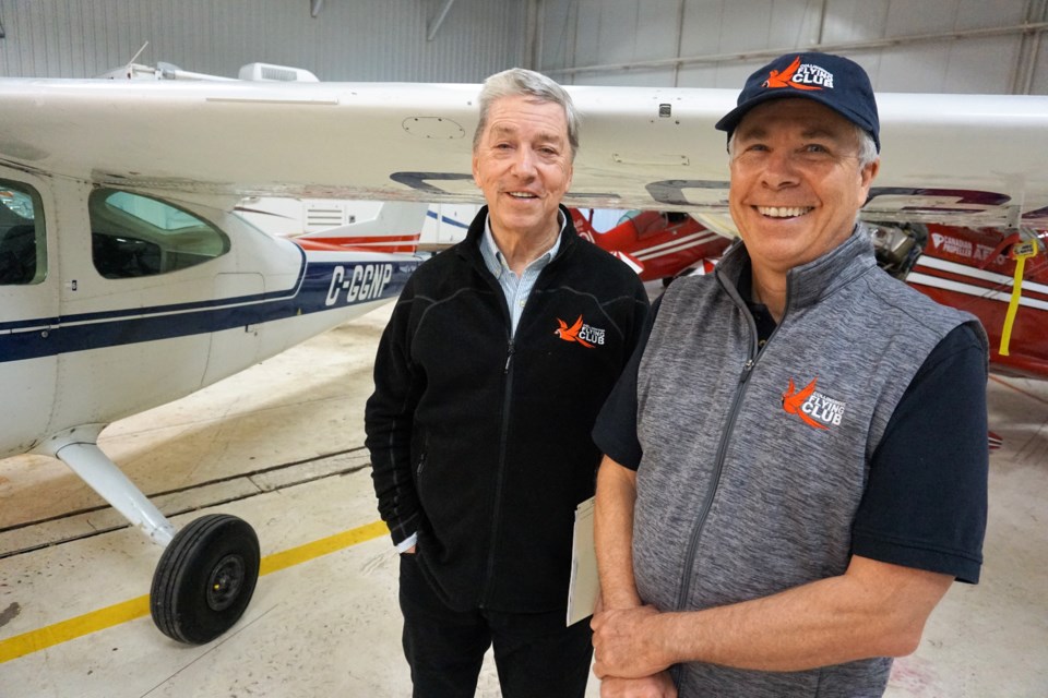 From left, Peter Glen and Neil Mellor with the Collingwood Flying Club's Cessna Cardinal C-177.    