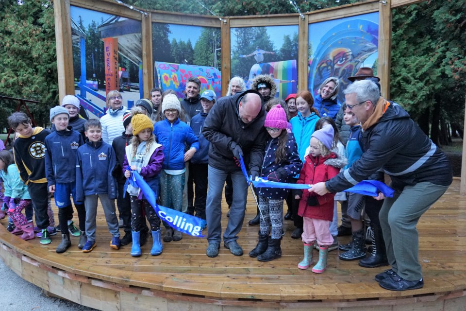 Mayor Keith Hull cuts the ribbon on the new Sunset Point Playground opening on Oct. 19, 2022.    