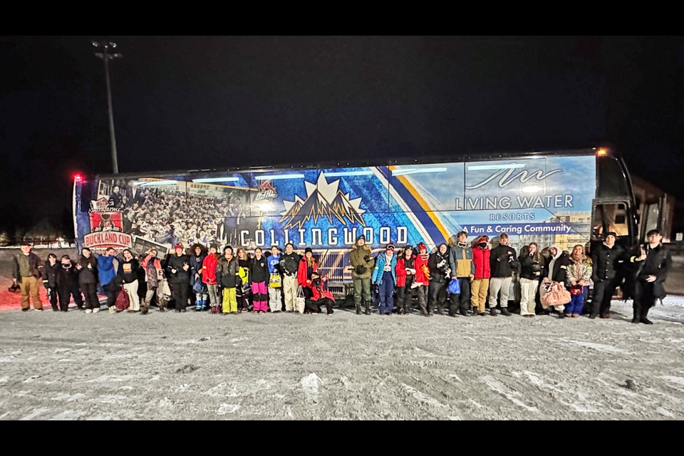 Second Tracks participants pose in front of a bus at Blue Mountain Resort on their final night of the program.