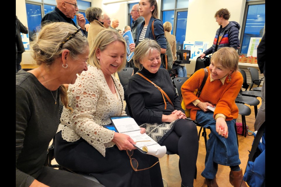 Jeanette Beck, left, speaks with other residents and Coun. Deb Doherty, right, about the 2025 budget during a Coffee with Council event on Nov. 20.