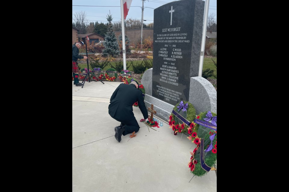 Mas. Cpl. Bryant lays down a poppy in remembrance. Greg McGrath-Goudie/CollingwoodToday