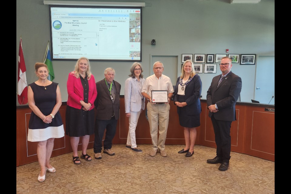 From left: councillors Gail Ardiel, Paula Hope, Alex Maxwell and June Porter, The Blue Mountains Senior of the Year Brian Harkness, Mayor Andrea Matrosovs and coun. Shawn McKinlay.