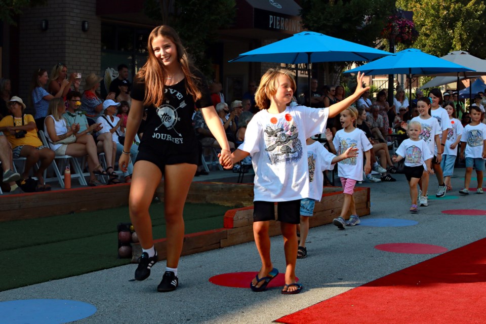 Fashion Fest 2024 presented by Camille Turner from Camille's Boutique, celebrated local business owner Angela Husvik's memory through a night of fashion, dancing, and fun on Saturday, Aug. 10 in Ladner Village.