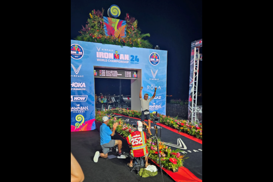 Gene Lecuyer crosses the finish line in Ironman World Championship in Hawaii.