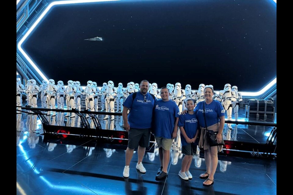 Ladner family Mark, Cooper, Tyson and Erin Greaves liked the Star Wars ride at Walt Disney World. Photo courtesy Make A Wish 