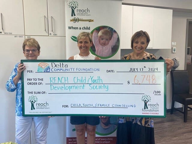 Sandra O’Keeffe, Gillian Lowrey (VP Delta Community Foundation), Rene D’Aquila with funding provided to Reach. Delta Community Foundation Photo 