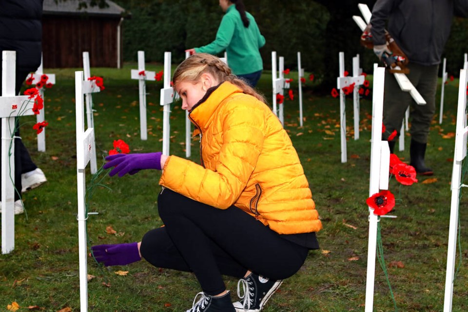 Last Friday (Nov. 1), the Crosses of Remembrance were once again installed in South Delta, as members of the South Delta Secondary School Interact Club placed 41 crosses in the field near the South Delta Recreation Centre. Jim Kinnear Photos 