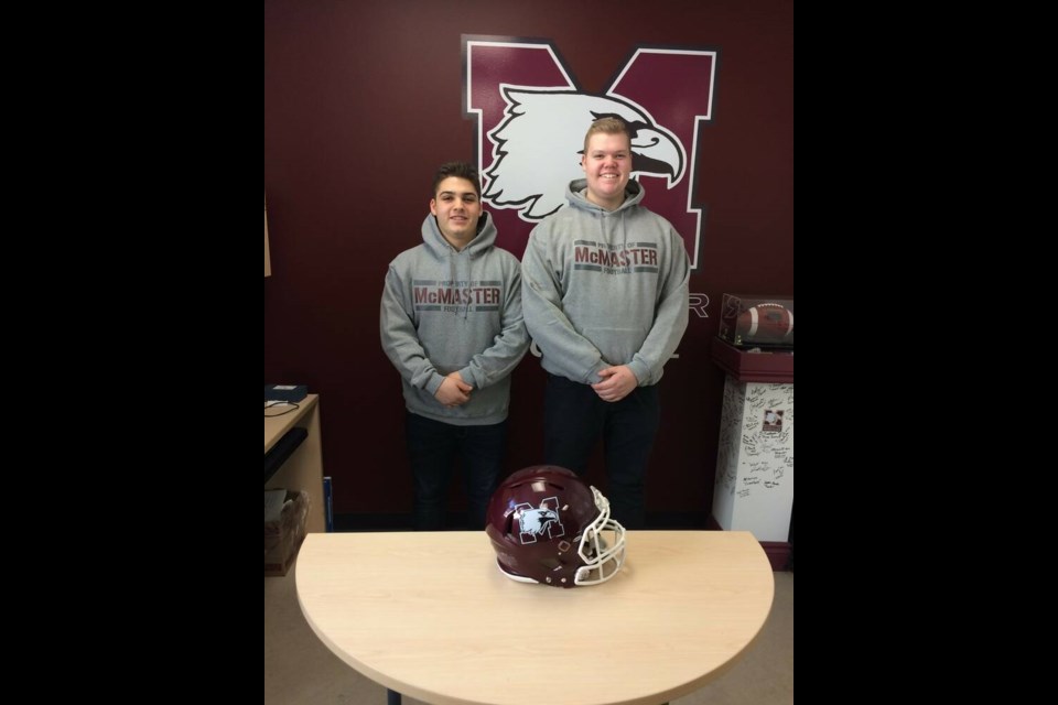 Stef Goulas and Justin Smith pictured when they signed their football scholarships with McMaster University. Photo courtesy Angela Smith 