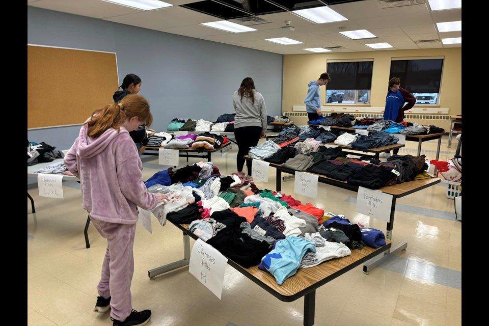 Students shop through the clothing selection donated by their peers